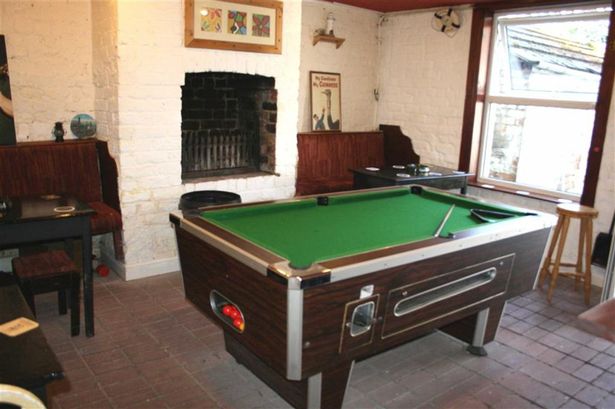 The basement pub even has a pool table